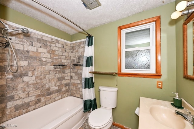 full bathroom featuring a textured ceiling, vanity, shower / tub combo, and toilet