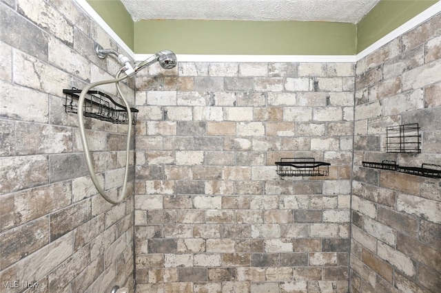 interior details featuring a shower