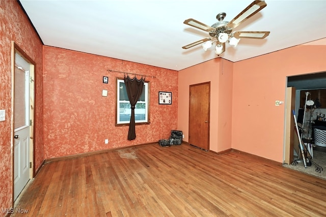 spare room featuring light wood-type flooring and ceiling fan