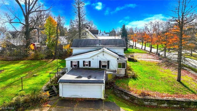 exterior space with a garage and a yard