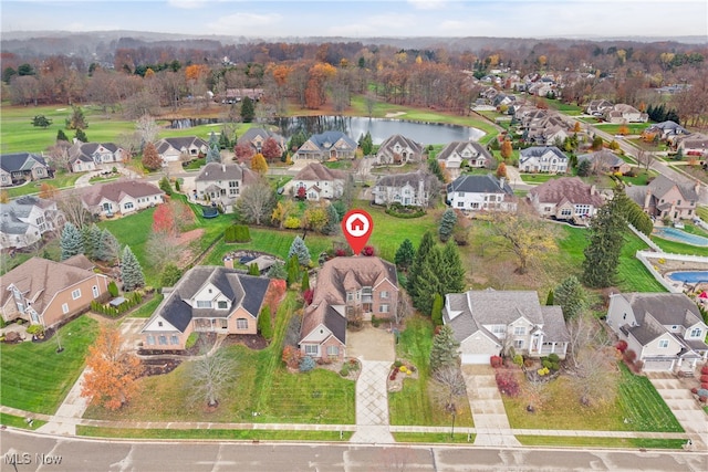 birds eye view of property with a water view