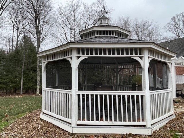 view of side of home with a gazebo