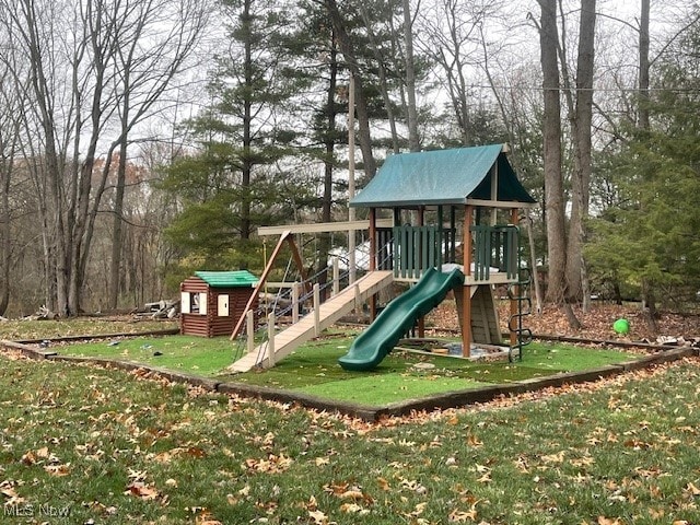 view of playground with a lawn