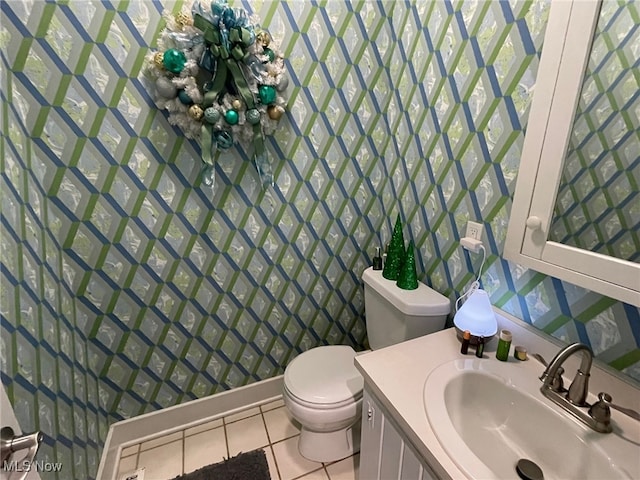 bathroom with tile patterned floors, vanity, and toilet