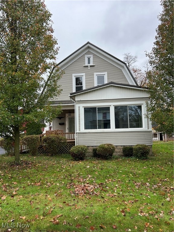 view of side of home featuring a yard