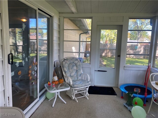 sunroom with wood ceiling