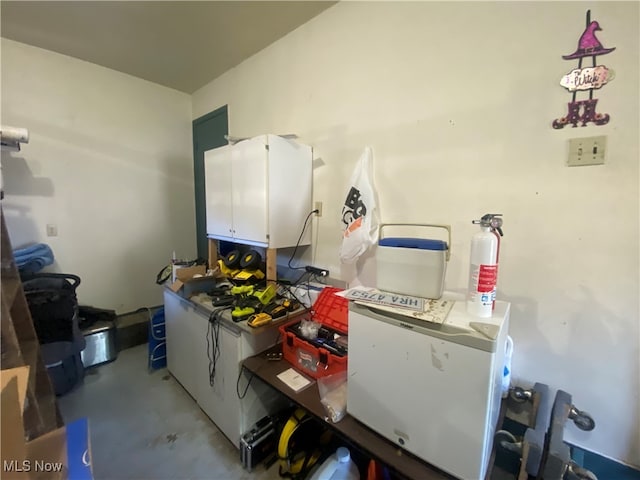 kitchen featuring white cabinets and white refrigerator