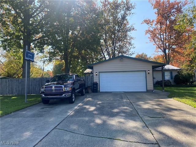 garage featuring a yard