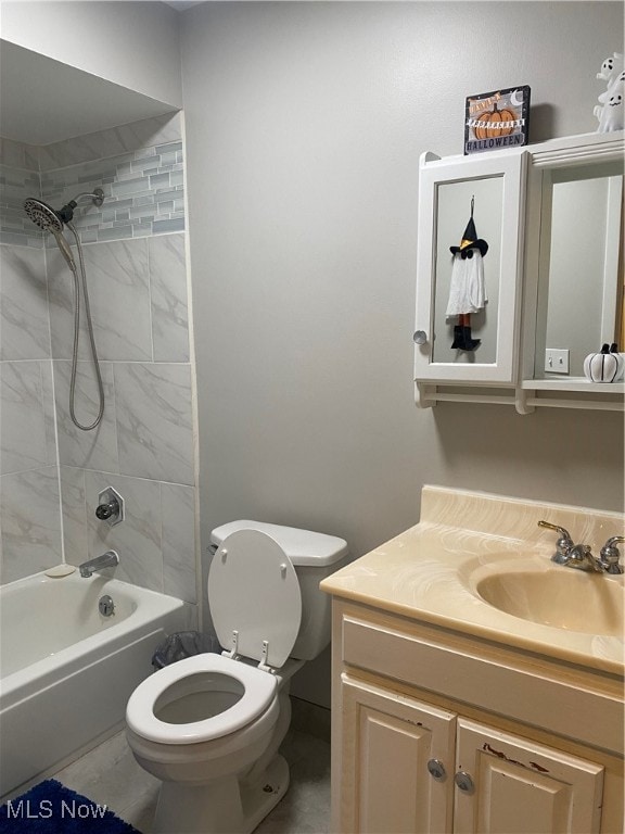 full bathroom featuring tile patterned floors, vanity, toilet, and tiled shower / bath