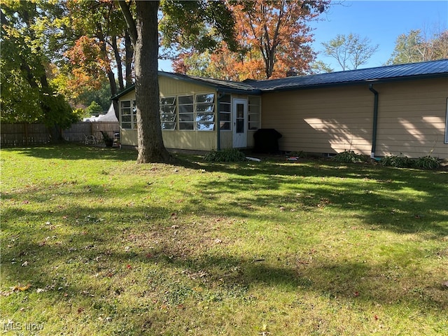 exterior space with a lawn