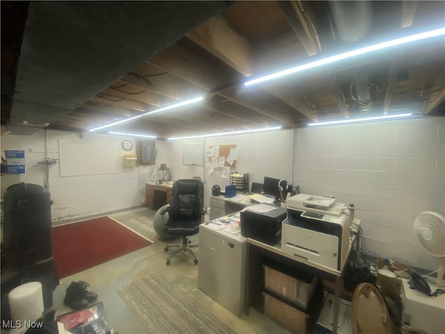 home office with concrete flooring