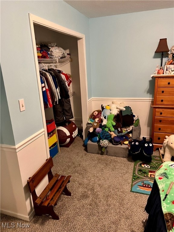 bedroom featuring a closet and carpet