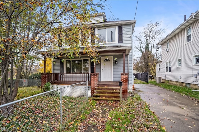 view of front of property with covered porch and cooling unit