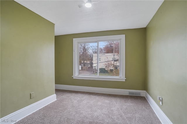 empty room featuring carpet floors