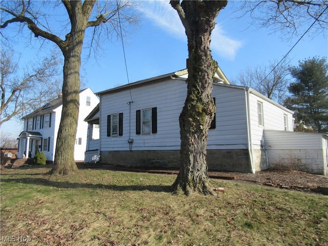 view of property exterior featuring a yard