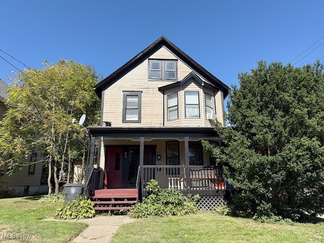 view of front of home featuring a porch and a front yard