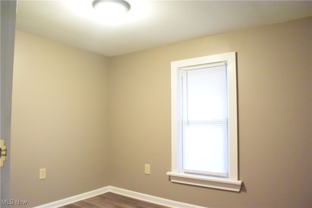 spare room featuring hardwood / wood-style flooring