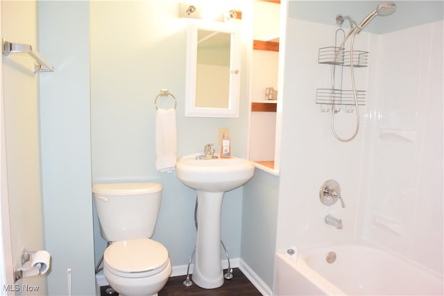 full bathroom with sink, shower / bathing tub combination, wood-type flooring, and toilet