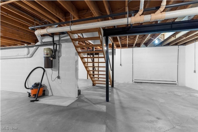 basement featuring a baseboard heating unit