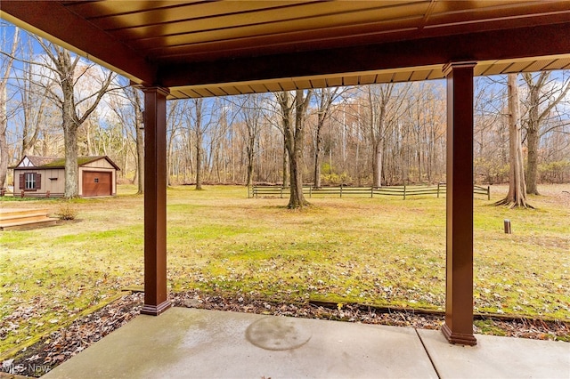 view of yard with a patio area and an outdoor structure