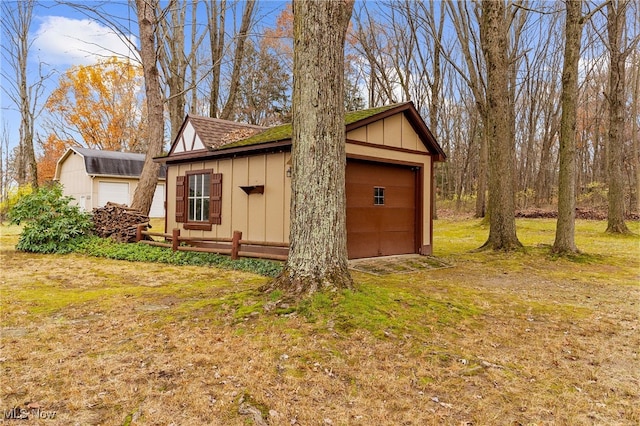 exterior space with a lawn and an outbuilding