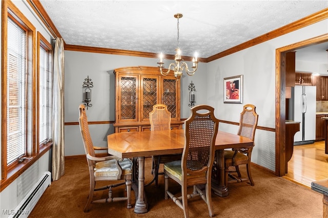 carpeted dining room with a textured ceiling, an inviting chandelier, crown molding, and a baseboard radiator