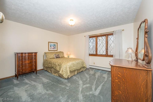 bedroom with a textured ceiling, carpet floors, and baseboard heating