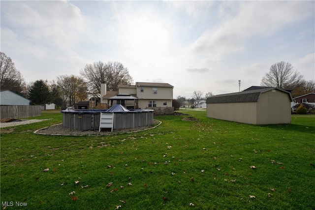 view of yard featuring a covered pool