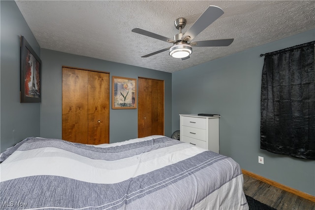 bedroom featuring hardwood / wood-style floors, ceiling fan, and a textured ceiling