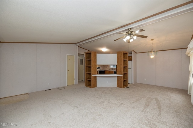 unfurnished living room with lofted ceiling with beams, light colored carpet, ceiling fan with notable chandelier, and ornamental molding