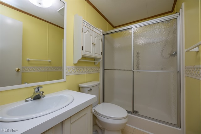 bathroom featuring sink, tile patterned flooring, toilet, ornamental molding, and an enclosed shower