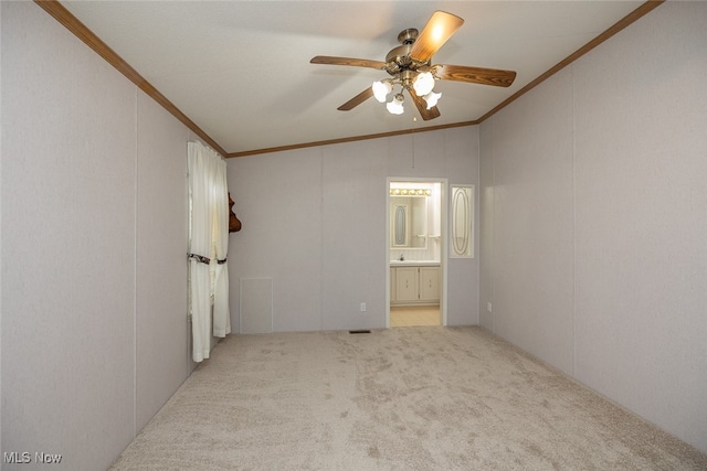 carpeted spare room with ornamental molding, ceiling fan, and lofted ceiling