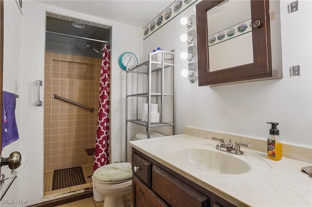 bathroom featuring vanity, toilet, and walk in shower