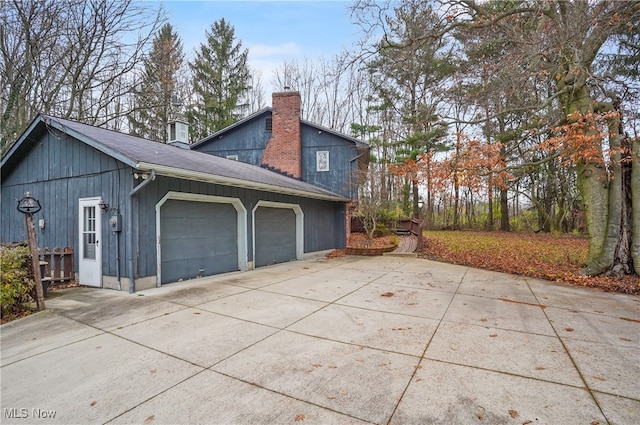 view of property exterior featuring a garage