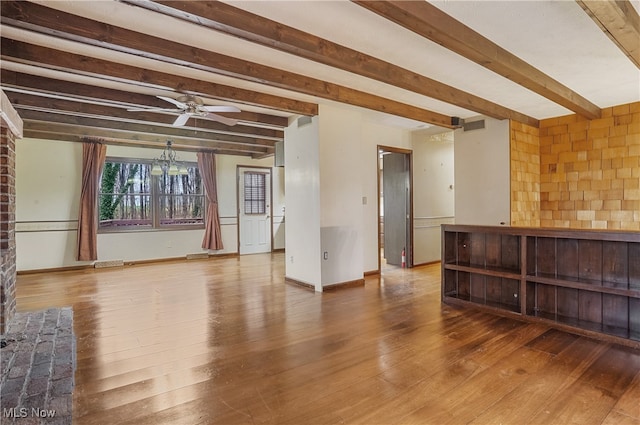 unfurnished living room with beam ceiling, ceiling fan, and hardwood / wood-style floors