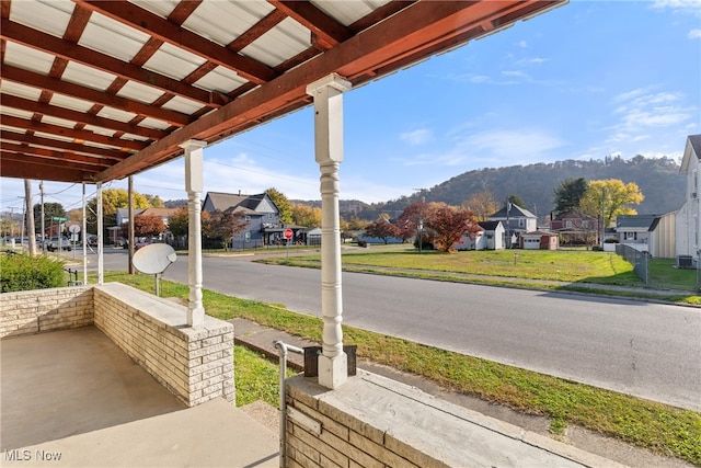 view of patio with a mountain view and a porch