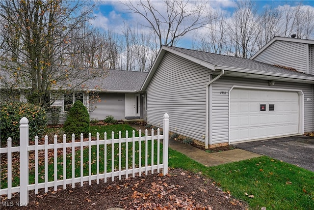 view of property exterior featuring a garage