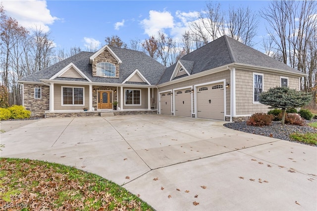 view of front of property featuring covered porch and a garage