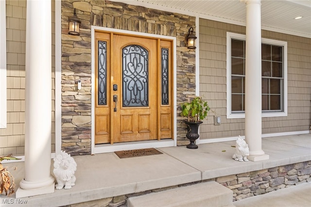 property entrance featuring covered porch