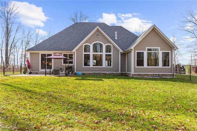 back of house with a lawn and a patio area