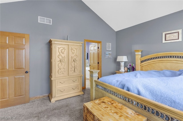 carpeted bedroom featuring high vaulted ceiling