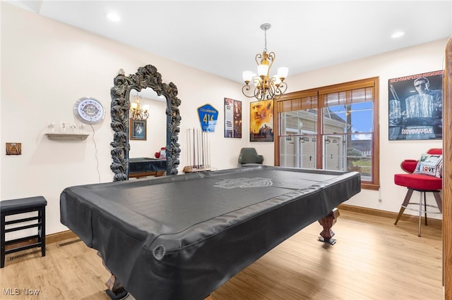 game room featuring a chandelier, light hardwood / wood-style flooring, and pool table