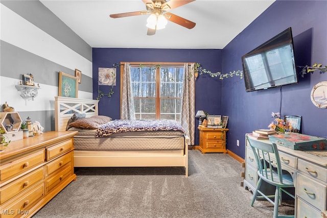 bedroom with dark colored carpet and ceiling fan