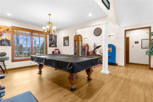 rec room with ornate columns, billiards, a notable chandelier, and light wood-type flooring