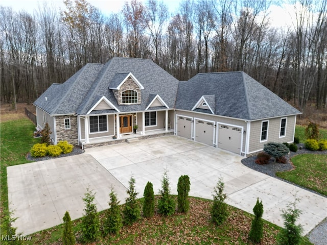 view of front of property with a porch and a garage