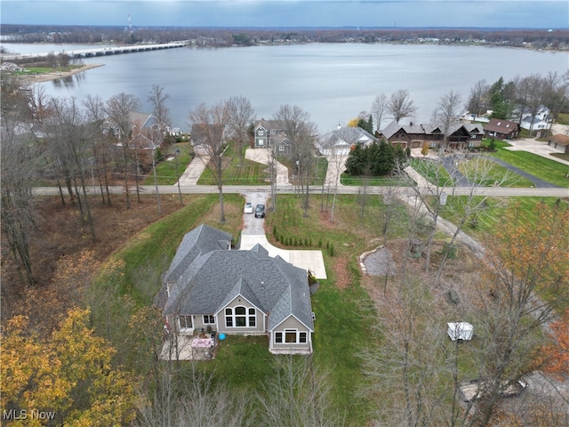 birds eye view of property with a water view