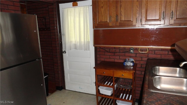 kitchen with stainless steel refrigerator and sink