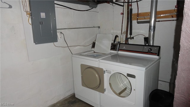 clothes washing area featuring separate washer and dryer and electric panel