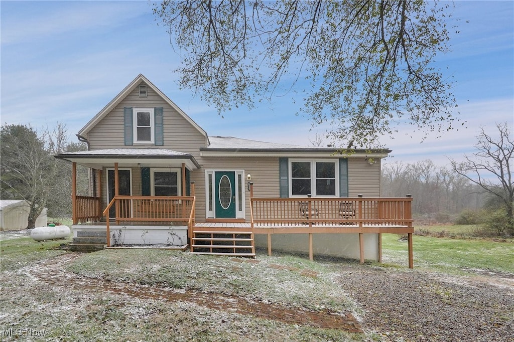 view of front of house with a porch and a wooden deck