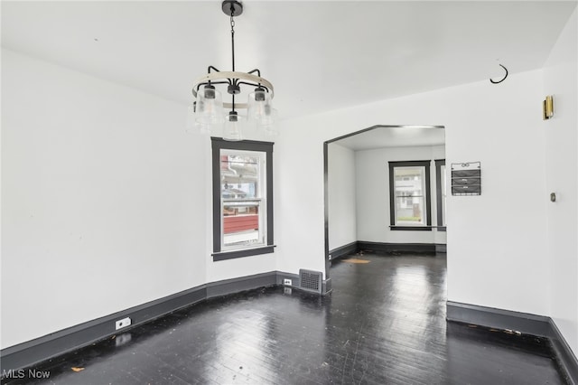 unfurnished room with dark hardwood / wood-style flooring